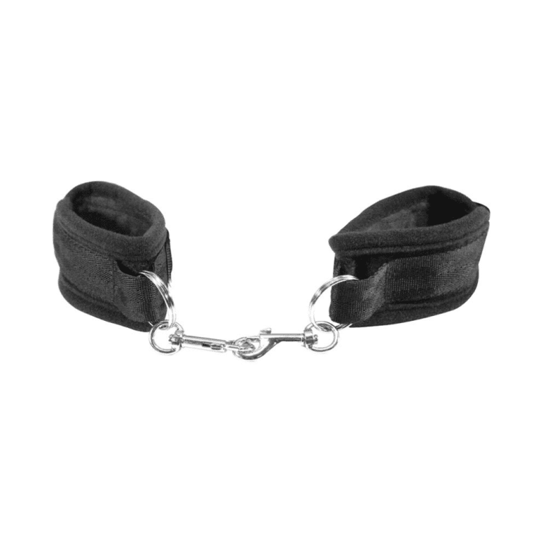 black and metal velcro handcuffs against a white background