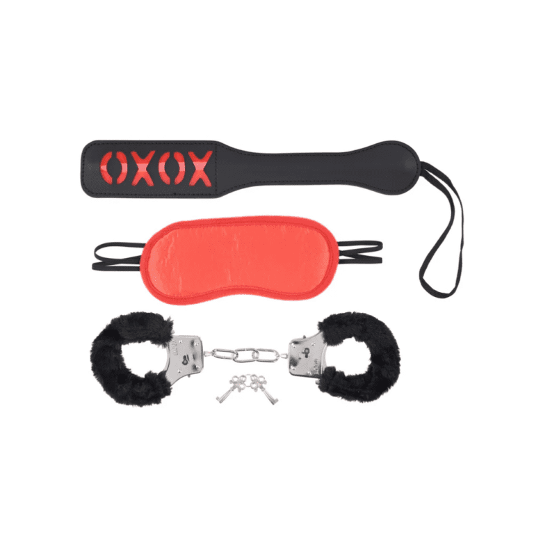 a black and red impact paddle with xoxo at the top, in the middle a red satin blindfold and on the bottom black fuzzy and metal handcuffs with a set of keys against a white background