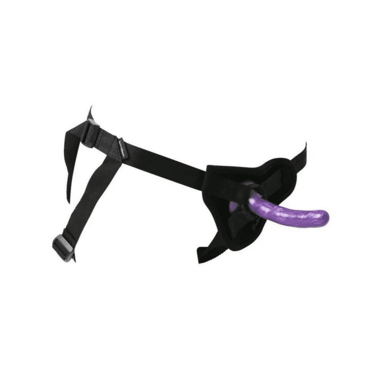 a harness with a purple dildo strapped on against a white background