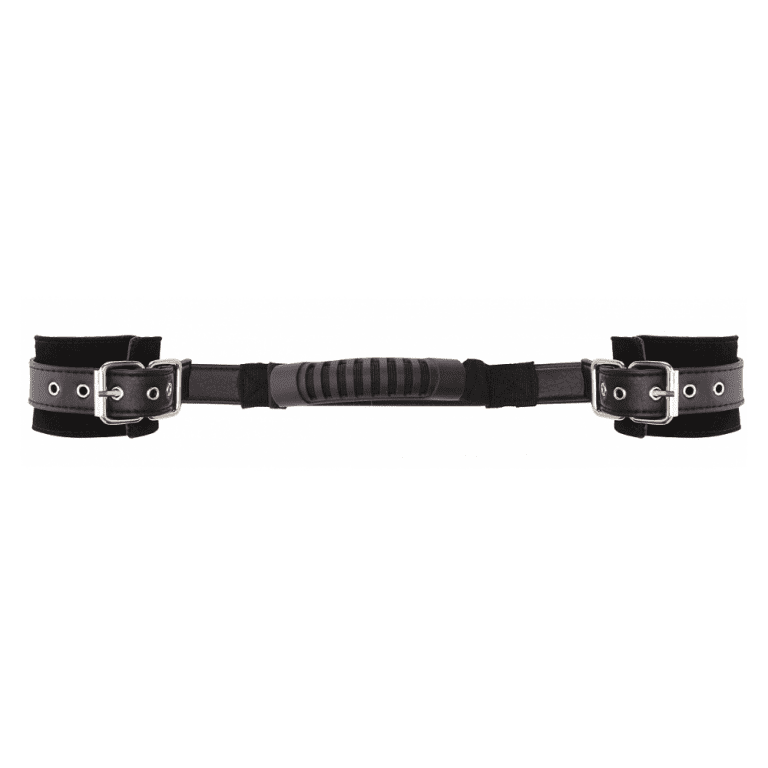 Two black pleather handcuffs with metal buckle and rivets connected in the middle by a pleather strap