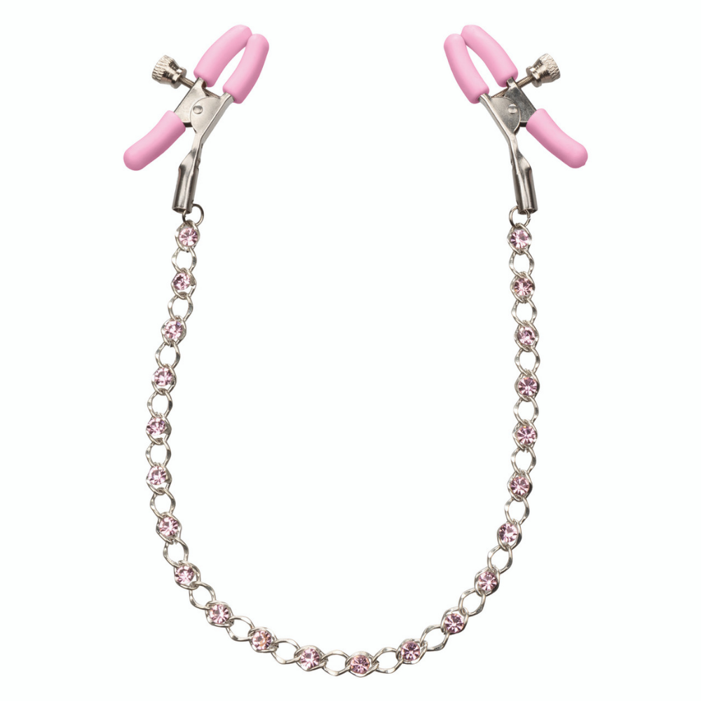 pink nipple clamps connected by a silver and pink crystal chain in a u shape against a white background