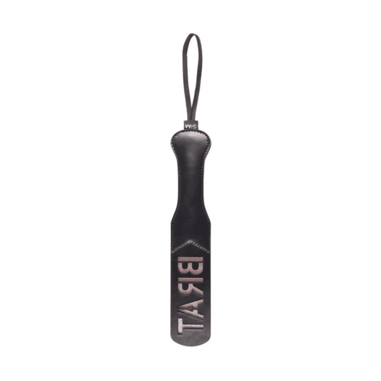 black and rose gold impression paddle with the word BRAT mirrored backwards against a white background