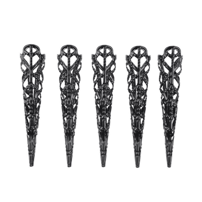 five black metal pointy and intricate fingertip jewelry against a white background