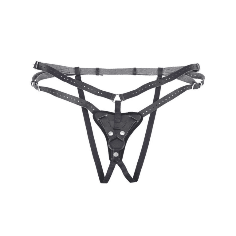 a high-waisted faux leather harness for dildos against a white background